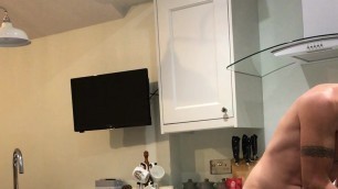 Nudist in kitchen